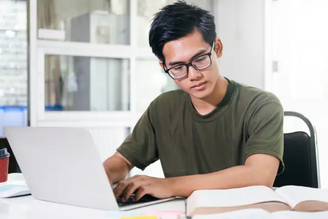 male student reviewing for exam - featured image