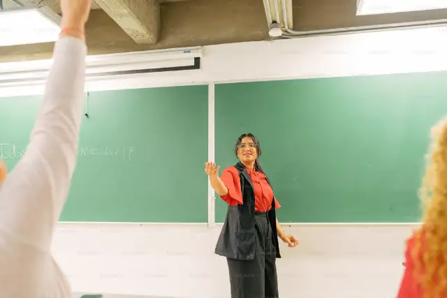 woman standing in front of blackboard - featured image